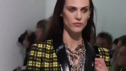 Versace reinterprets punk with vinyl, spikes and nails in Milan News Clip