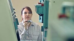 Female repairman examining equipment with flashlight Stock Footage