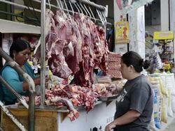 MS Woman purchasing meat at shop / Otavalo, Ecuador Stock Footage