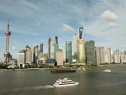 WS Panorama view behind Hwangpo River and cargo ship moving in river / Pudong, Shanghai, South Korea Stock Footage