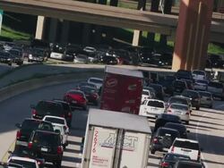 Long lens, overhead, huge traffic congestion on hot interstate highway. Stock Footage