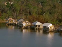 Sept. 12, 2005 aerial damaged stilt houses on Lake Pontchartrain in wake of hurricane / Louisiana Stock Footage