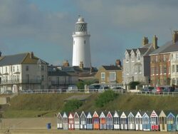 Southwold,colourful beach huts,People walking on promenade,,Lighthouse,MS, Stock Footage