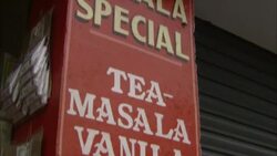 A sign advertises spices at a market in India. Stock Footage