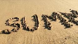 SUMMER written in golden sand Stock Footage