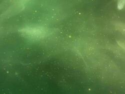 Golden flash and particle on green vapour space Stock Footage