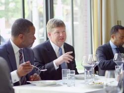 MS business executive leading discussion during business lunch meeting in restaurant Stock Footage