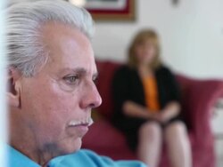 Sorrowful Latin Man with Woman in Background Stock Footage