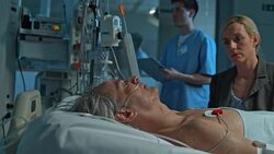 DS Woman holding sleeping husband's hand in ICU Stock Footage