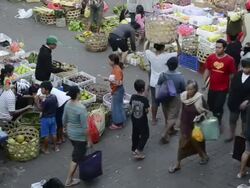 MS Vendor selling fruits in crowded market area / Ubud, Bali, Indonesia Stock Footage