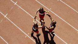 Male runners celebrating on track Stock Footage