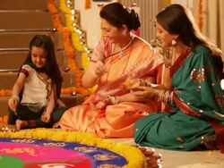 Family preparing rangoli in diwali festival Stock Footage