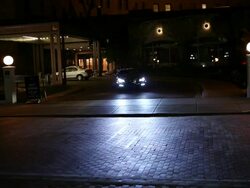 MS TS Well dressed young man driving in modern convertible car in urban area at night / Minneapolis, Minnesota, United States Stock Footage