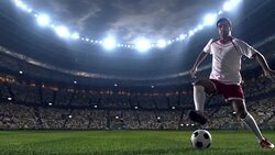 Soccer player dribbling a ball on the field Stock Footage