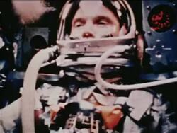 1962 close up astronaut (John Glenn) in spacesuit sitting in Mercury 6 space capsule / newsreel Stock Footage