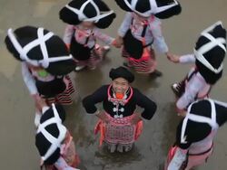 Local dancing girls in traditional chinese costumes, Long Horn Hiao, Sugao, Guizhou Province, China, Asia Stock Footage