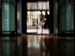 MS R/F Middle aged couple walking into lobby of upscale hotel in urban area / Minneapolis, Minnesota, United States Stock Footage