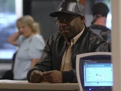 MS Job seeker standing and talking at counter of state run job center / Jackson, Michigan, United States  Stock Footage