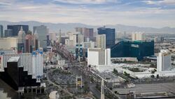 Traffic travels on The Strip, past casinos and hotels in Las Vegas. Stock Footage