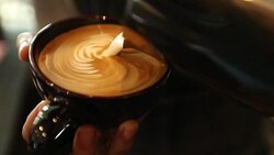 Tutorial barista making art latte, slow motion Stock Footage