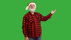 adult senior beard man showing an copy space and showing a thumb  in a hat santa claus  on a green background Stock Footage