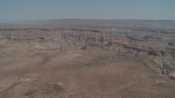 Rugged mesas and deep ravines characterize the vast Fish River Canyon in Namibia. Stock Footage