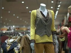 HD DOLLY: Window Dresser Dressing The Mannequin Stock Footage