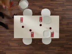 MS, Lockdown of a couple clearing a dining table, overhead view Stock Footage