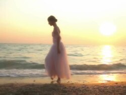 ballerina dancing on the beach Stock Footage