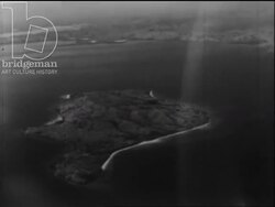 Madagascar c.1958 - wounded is helped on to plane. Views of the islands Nosy Be and Nosy Komba Stock Footage