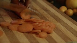 Slicing carrot Stock Footage