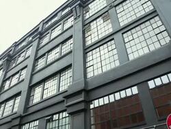 CU TD View of 1900's warehouse style building and colorful iconic street level graffiti art / London, Greater London, UK Stock Footage