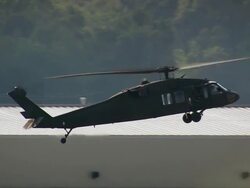 Sept. 11, 2005 aerial Black Hawk helicopter landing at Baton Rouge Metropolitan Airport Stock Footage