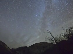 WS ZO PAN T/L View of  milky way and night sky above convict Lake in  Eastern sierra nevada moutains / Manmoth Lakes, CA, United States Stock Footage