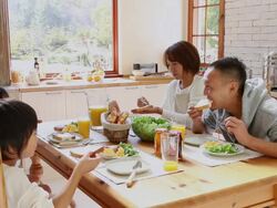 MS Family eating breakfast in kitchen / Fujikawaguchiko, Yamanashi, Japan Stock Footage