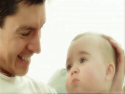 CU Father cuddling baby Stock Footage