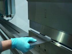 Close up shot of pieces of metal being bent in a machine. Stock Footage
