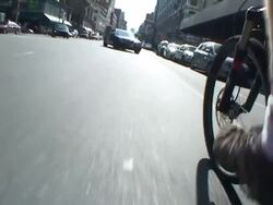 A cyclist pedals along a street in New York City. Stock Footage