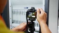 Camera Operator set up the camera before shooting Stock Footage