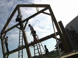WS Carpenters at working while framing an energy efficient post / Grass Lake, Michigan, USA Stock Footage