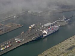Aerial wide shot pan moored ferry at Belfast docks/ Northern Ireland Stock Footage