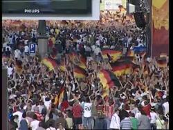 Fans watch on giant screens, reacting to goals and near misses News Clip