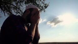 Islamic Man Praying Outdoors Stock Footage