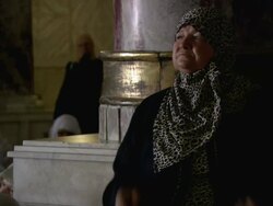MS Traditional woman praying besides pillar in mosque / Jerusalem, Palestine, Israel Stock Footage