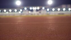 Slow Motion Running in track at Night with Floodlight Background Stock Footage