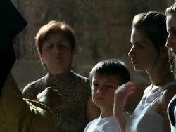 MS People standing in line and man feeding to girl  / Armenia Stock Footage