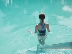  HA Swimmer walking into pool and swiming away / Miami, Florida, United States Stock Footage