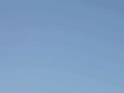 M/S airline pilot steps into frame, airplane passes overhead: American Airlines Boeing-737 Stock Footage