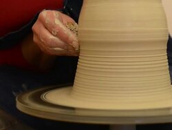 CU TU Shot of female potter shapes pitcher on potterwheel at pottery / Landshut, Bavaria, Germany Stock Footage