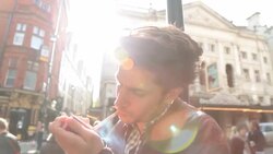 A young man strikes a match to light his cigarette. Stock Footage